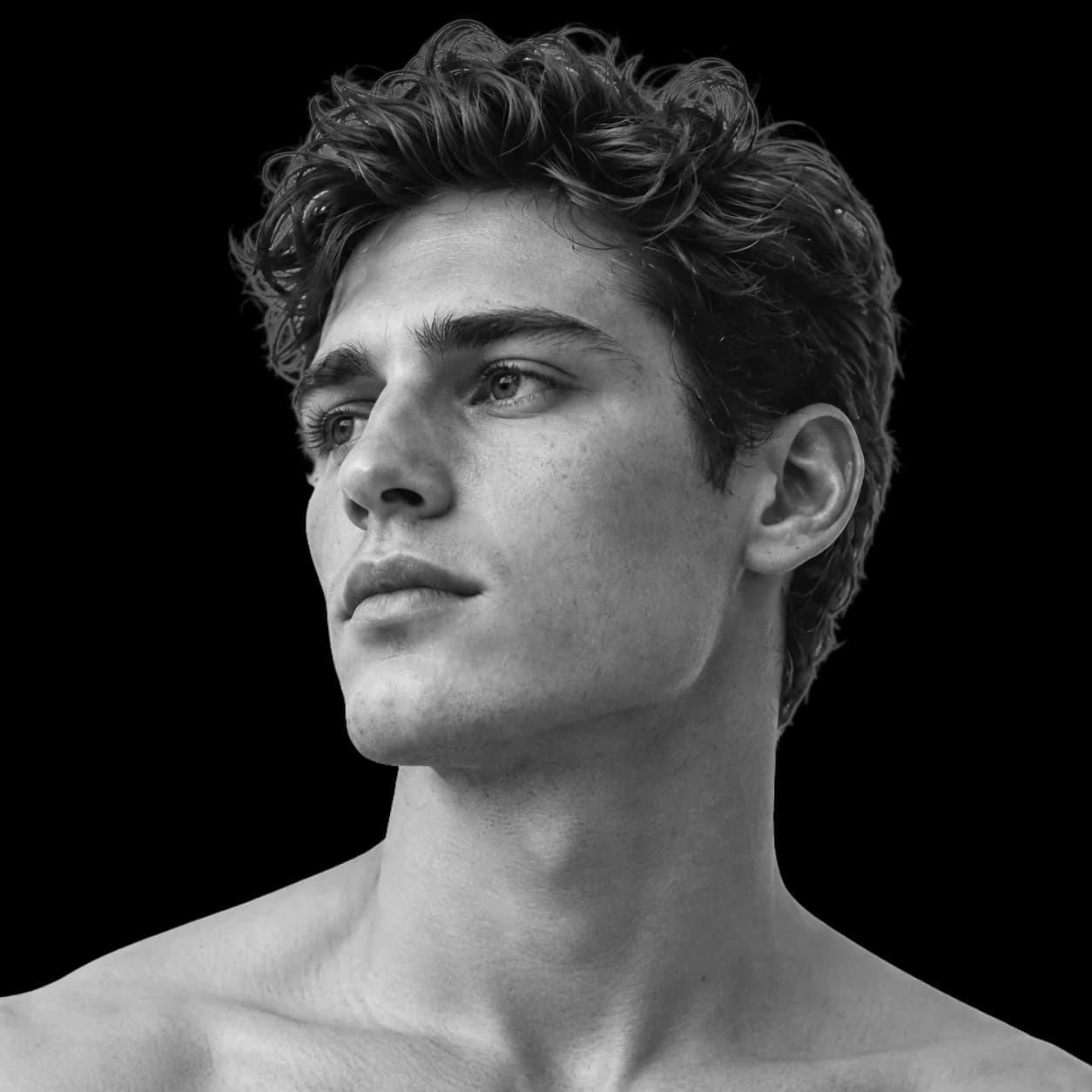 A man's face in three-quarter view, black and white